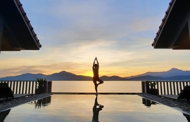 Doing Yoga in Vedana Lagoon Resort Hue